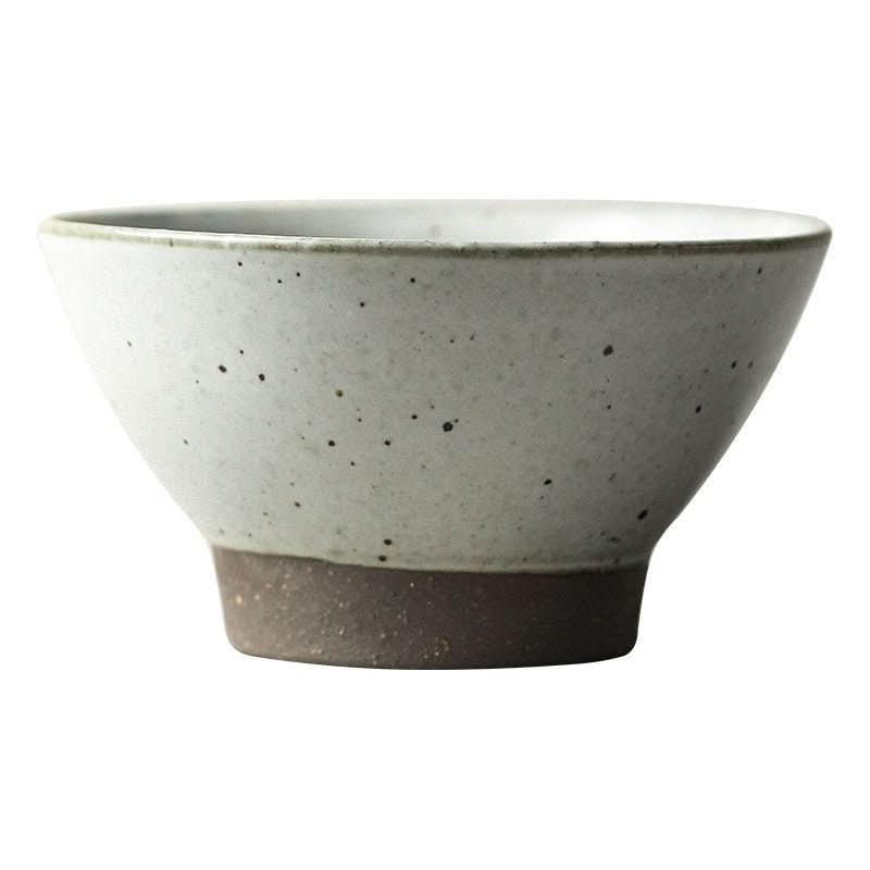 Rustic 6.5" stoneware clay bowl, speckled white with dark base. Perfect for cereal, rice, pasta, fruit, or soup.